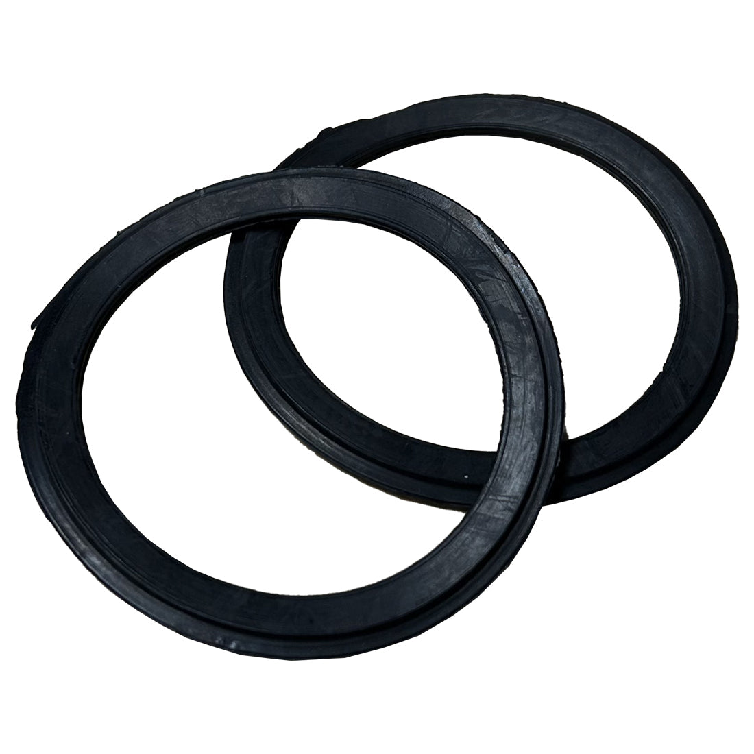 Three black rubber rings stacked on a white background