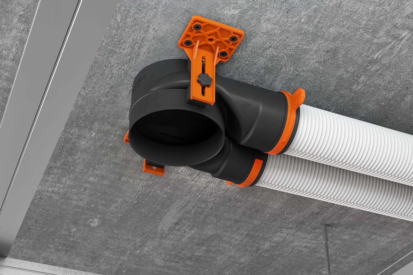 Black and orange duct connector with a white hose on a gray floor.
