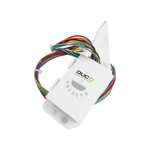 White electronic module with colorful wires on a white background