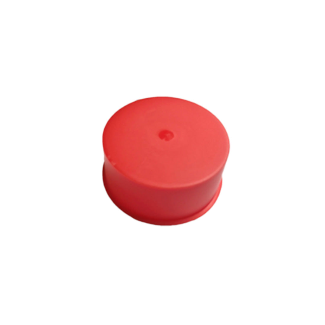Red cylindrical object on a white background