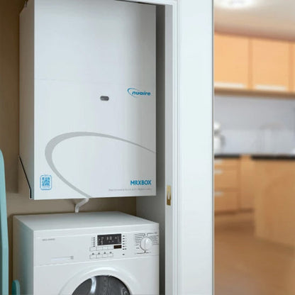 White appliance with 'nuare' branding in a kitchen setting