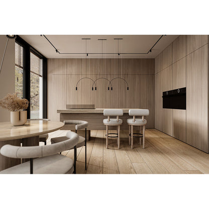 Modern kitchen with wooden cabinets and a dining area.
