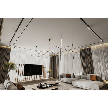 Modern living room with gray sofa, TV, and decorative elements.